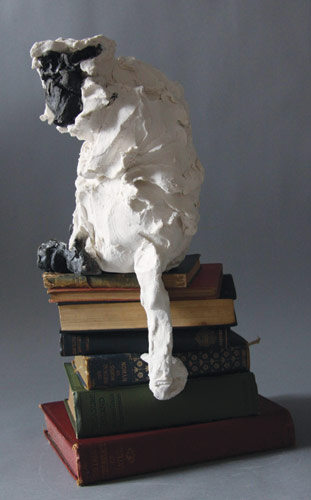 Monkeys sat on books